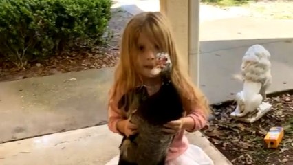 Cute girl shows up to the front door with a wild duck in hands