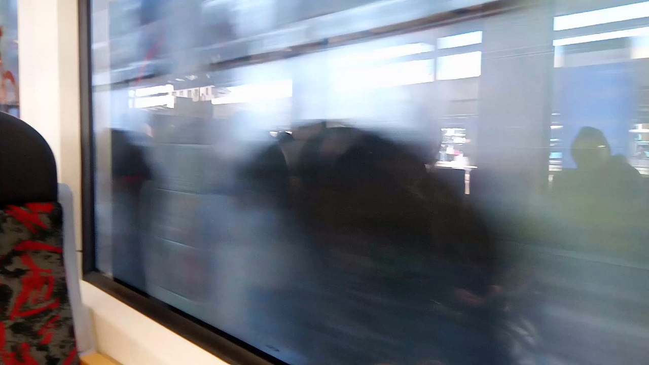 Wall passing near train window