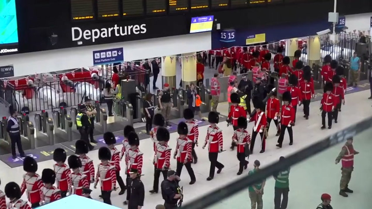 Soldiers arrive by train at London Waterloo for King’s coronation