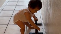 11-month-old baby tries catching up to her gymnast siblings by doing a handstand