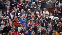 Coronation day: Royal fans cheer and applaud soldiers marching down Mall