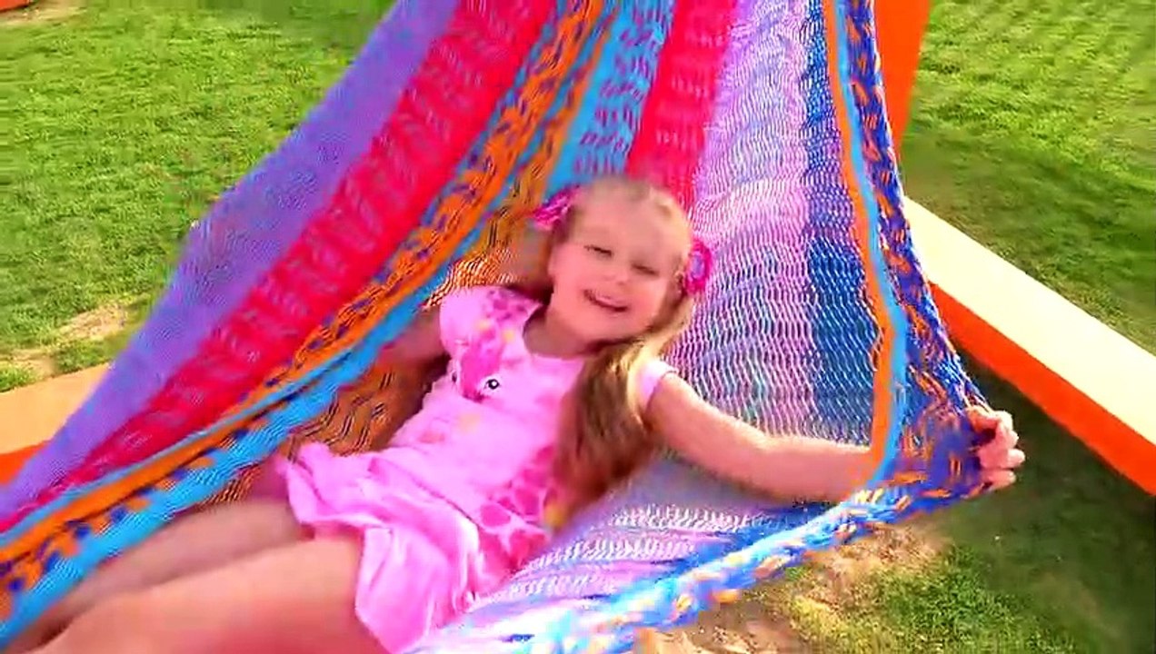 Diana and Roma playing with Dad at the playground