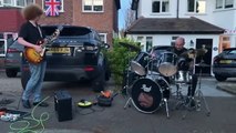 Police officer filmed playing an impromptu drum set at a coronation street party