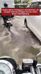 Hujan deras menguyur semalaman, air sungai meluap hingga keruas Jalan Raya Tebongkang