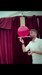 Circus Performer Catches Stacked Blocks on Stick