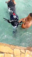 Driving A Bike Into A Pool