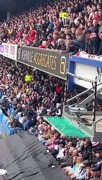 QPR fan having a bit of fun with a flag dropped by the Bristol City fans in the top tier Wait till the end