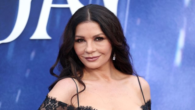 Catherine Zeta-Jones Matched the Red Carpet in a Plunging Fiery Gown and Cape