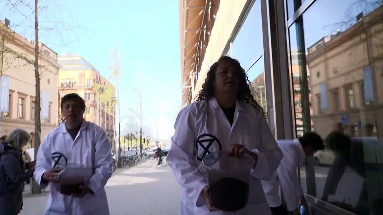Climate activists throw fake blood on Swedish finance ministry