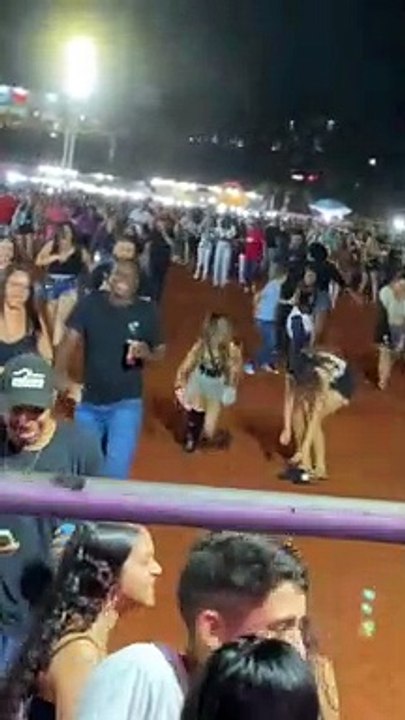 Woman Trips While Running With Crowd