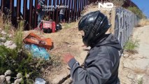 Migrants waiting on US side of Mexican border order takeaways from Tijuana
