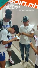 Jack Animam and Janine Pontejos accommodate a fan after Gilas win over Vietnam