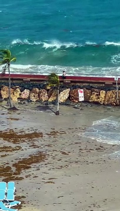 Couple Gets Knocked Off Path By Waves