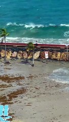 Couple Gets Knocked Off Path By Waves