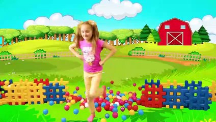 Sasha playing with Colored Blocks Toy Buses