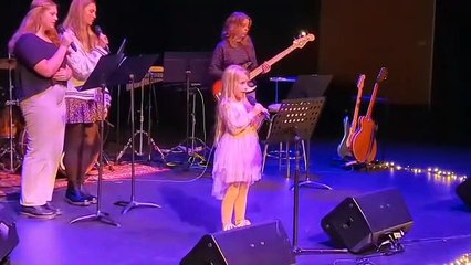 Evie Paris sings her prize winning song