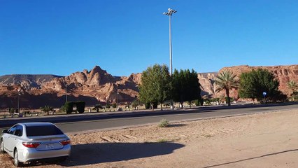 A view of the winter park of Madain Saleh, Al-Ula, surrounded by ancient rocks.