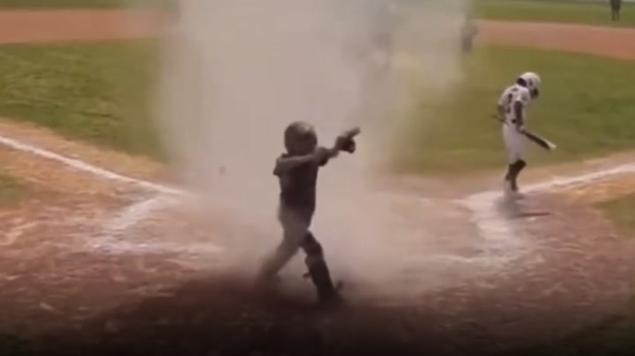 Moment dust devil engulfs 7-year-old baseball player in middle of game