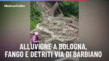 Alluvione a Bologna, fango e detriti via di Barbiano