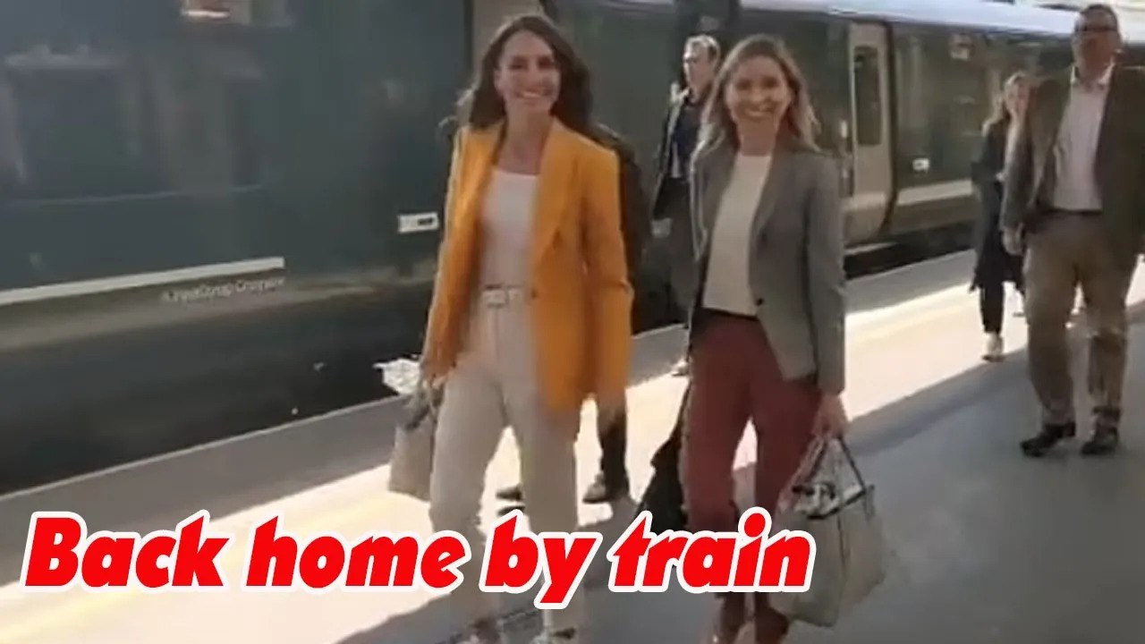 Sweet moment Kate talks to a group of children as she heads to the train station to return home