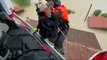 Footage shows people in Italy being airlifted from roofs of their flooded homes