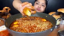 Mukbang noodles, a large bowl, sunny side up eggs, fried shrimp with chili sauce, burgers