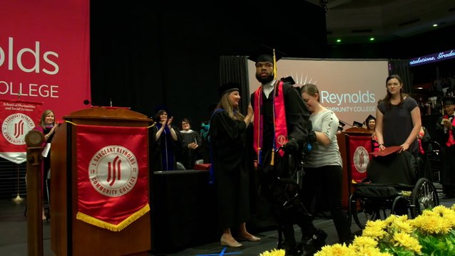 Moment paralysed shooting victim walks graduation stage using robotic exoskeleton