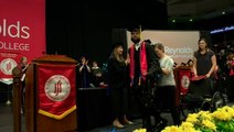 Moment paralysed shooting victim walks graduation stage using robotic exoskeleton