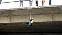 Climate activist hangs from Adelaide bridge during Extinction Rebellion protest