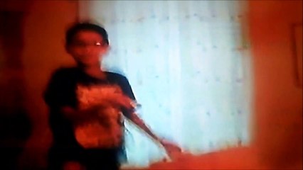 Jonathan playing the wii while Christopher & Anthony play with the toys