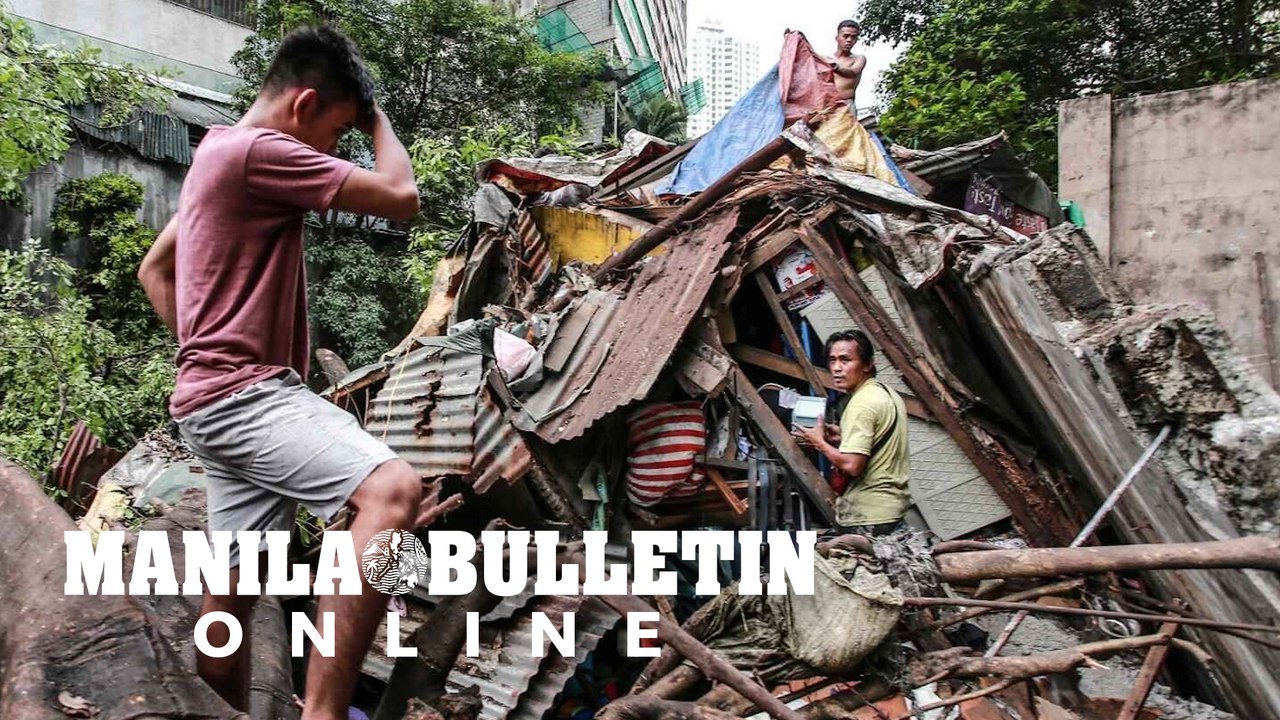 Residents locate their belongings after their houses got destroyed by a tree that collapsed near Estero de Magdalena in Binondo