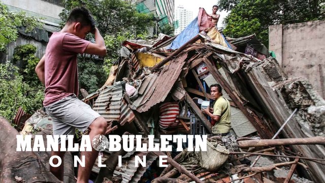 Residents locate their belongings after their houses got destroyed by a tree that collapsed near Estero de Magdalena in Binondo