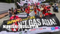 Climate campaigners hold a protest action against Japan and the G7 in front of Japan Embassy in Pasay City