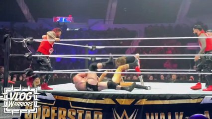 Sami Zayn offers Kevin Owens handshake during match at Holiday Supershow