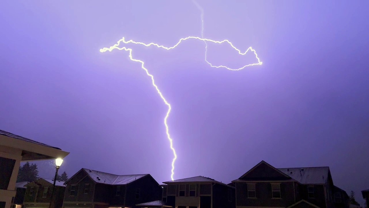 Slow Motion Lightning Ribbons Across Sky