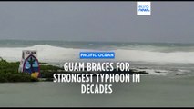 Rain and winds lash Guam as Typhoon Mawar closes in and residents shelter