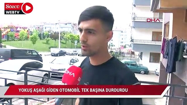Yokuş aşağı giden otomobili tek başına durdurdu