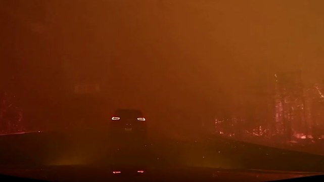 Car drives through raging Canadian wildfire in dramatic dashcam footage