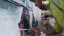 Au Yémen un artiste peint sur les murs détruits par la guerre civile