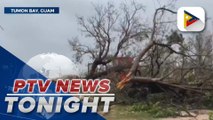 Flood, uprooted trees, damaged vehicles, and structures seen in Guam