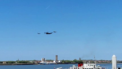 Spitfire, Hurricane and Lancaster Bomber fly over the RIver Mersey
