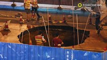 Caught on cam: Scooter rider busy on phone rides scooter straight into a giant sinkhole