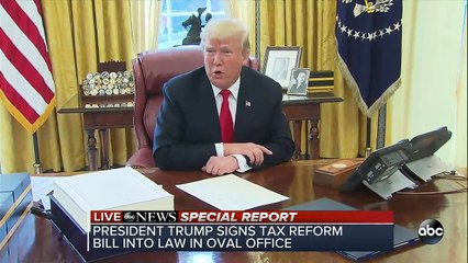 Donald Trump signs Tax Cuts and Jobs Act in Oval Office