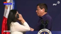 Rodrigo Duterte kisses woman during public event