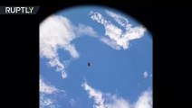 Satellite flies past International Space Station