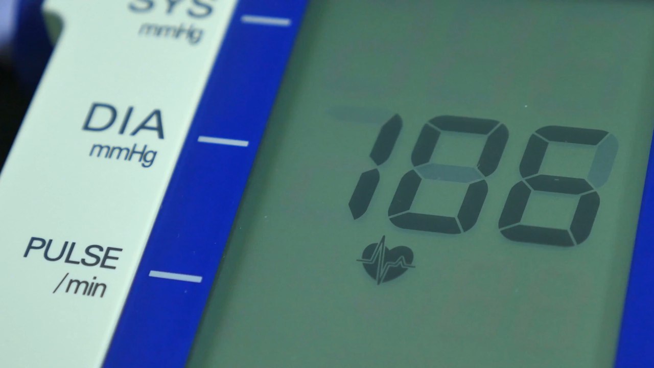 What does a blood pressure check involve and what are the treatments for high blood pressure?