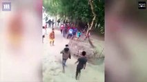 Wild rhino charges villagers in the middle of annual festival
