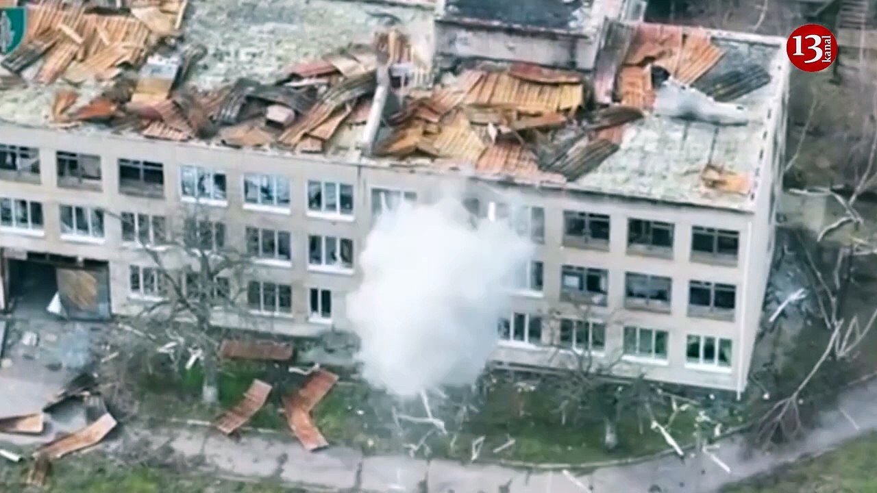 Image of Ukrainian kamikaze drones attacking building housing Russians in Kherson