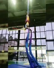 Girl Loses Balance on Aerial Silk Rope and Falls Down