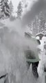 Woman Cleans Little Chunk of Snow from Her Snow-Covered Car in Truckee, California